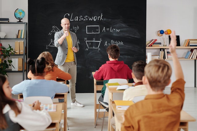 A teacher is giving a class to students.